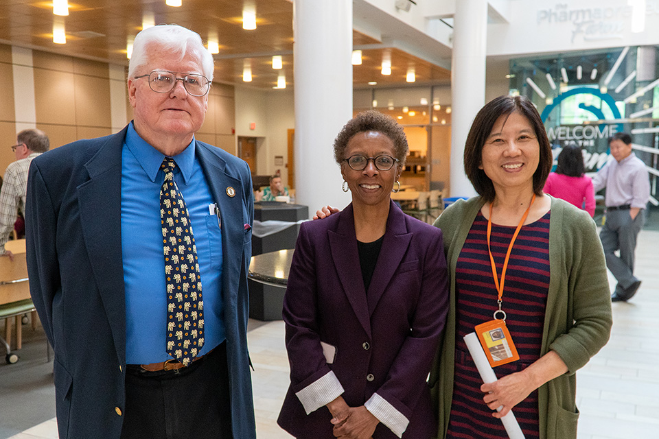 Ed Moreton, Dean Natalie Eddington, and Jia Bei Wang at the retirement party for Moreton and Wang.