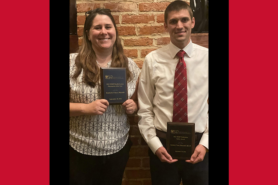 Kimberly Claeys and Zac Noel pose with awards at the MSHP awards dinner.