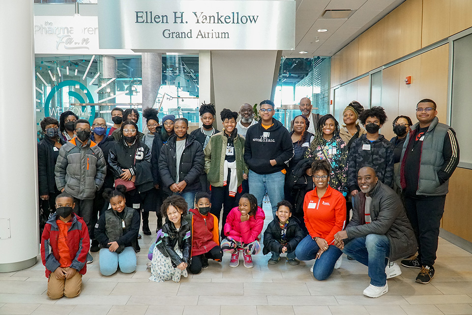 A group of home school students in the atrium of Pharmacy Hall.