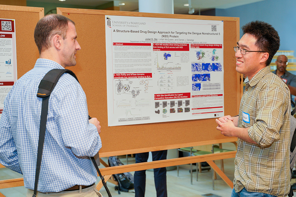 Discussions at the poster session at the CADD symposium.