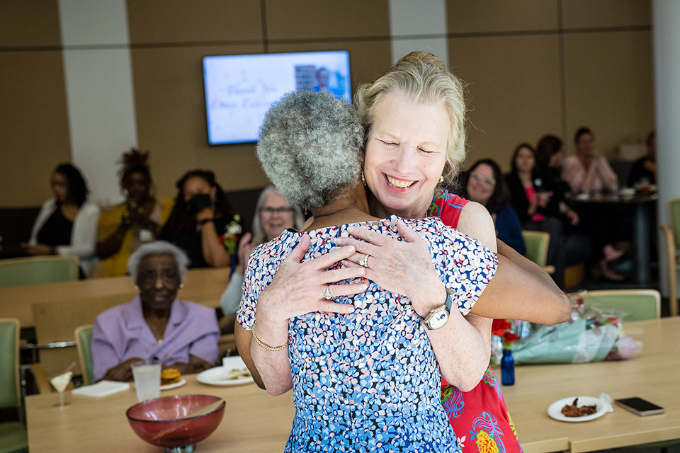 Ellen Yankellow and Natalie Eddington share a hug.